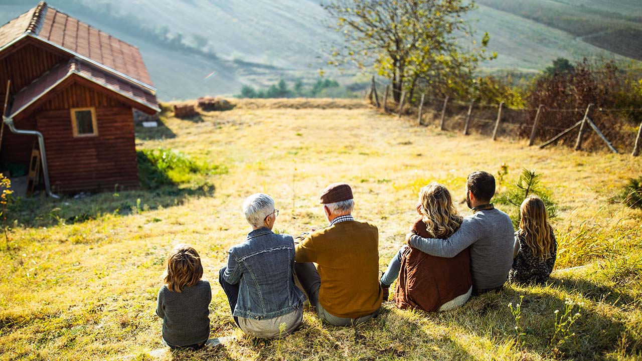 Family sitting on the grass field